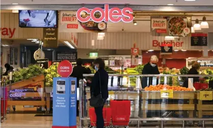  ?? Photograph: Lukas Coch/AAP ?? Coles said more workers were recruited and additional stock bought but the impact of Omicron was ‘materially greater than the contingenc­y plan anyone could put in place’.