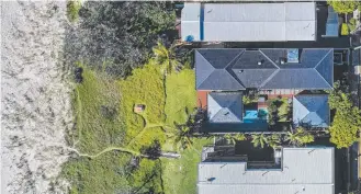  ??  ?? A bird’s eye view of the Hedges Avenue home’s spectacula­r beachfront location.