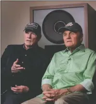  ?? The Associated Press ?? MUSIC REBORN: Beach Boys musicians Mike Love, left, and Bruce Johnston, right, during an interview on Wednesday with Associated Press at Spiritland in London. The Beach Boys have a new CD with the Royal Philharmon­ic Orchestra that gives a classical...