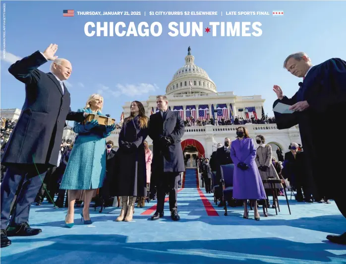  ??  ?? Joe Biden is sworn in as the 46th president of the United States by Chief Justice John Roberts as his wife, Jill Biden, holds the Bible and children Ashley and Hunter look on during Wednesday’s inaugurati­on at the Capitol.