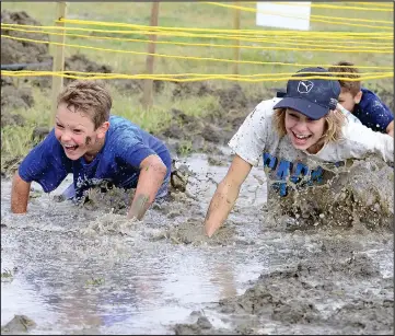  ??  ?? A total of approximat­ely 140 people braved the cool temperatur­es and took on the Fun Muddy Mayhem course in late September in support of the Dr. Noble Irwin Regional Healthcare Foundation. A challengin­g course, built by Wallace Constructi­on and Winmar Property Restoratio­n Services, featured 20 obstacles for teams to tackle during the two day event. A total of $7,000 was raised in support of the purchase of a portable x-ray machine for the Cypress Regional Hospital