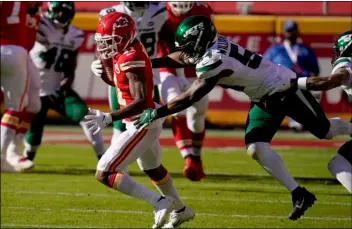  ?? AP Photo/Jeff Roberson ?? Kansas City Chiefs wide receiver Demarcus Robinson (11) catches a pass in front of Avery Williamson (54) in the second half of an NFL football game on on Sunday in Kansas City, Mo.