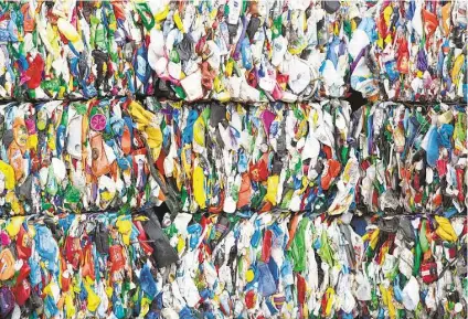  ?? Houston Chronicle file ?? Low oil prices make new plastic cheaper to make than using recycled plastic, adding to the challenge for Waste Management.