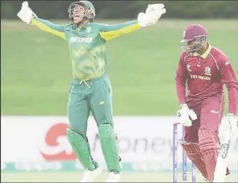  ??  ?? West Indies batsman Bhaskar Yadram falls to a catch at the wicket as Wandile Makwetu celebrates. (Photo courtesy ICC Media)