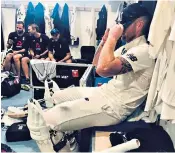  ??  ?? Ben Stokes is pictured taking a moment in the dressing room after his brilliant 135 not out on Sunday