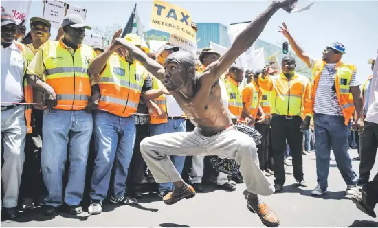  ?? Pictures: Jacques Nelles ?? WAR CRY. Taxi drivers sing and dance during a march to the Union Buildings yesterday.