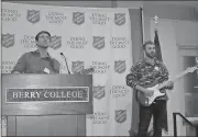  ??  ?? Andy Calvert (left) and Clayton Bell perform “Amazing Grace” at the close of The Salvation Army’s Celebratin­g 130 Years of Service dinner and awards ceremony.