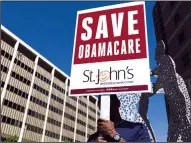  ?? TRIBUNE NEWS SERVICE ?? A supporter of the Affordable Care Act holds a sign during a rally on Monday in Los Angeles.