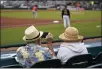  ?? GENE J. PUSKAR — THE ASSOCIATED PRESS FILE ?? Elderly socially distanced baseball fans watch a spring training game between the Pittsburgh Pirates and the Baltimore Orioles in Bradenton, Fla.