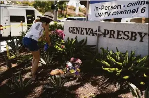  ?? Jae C. Hong / Associated Press ?? Joanna Garcia, 47, leaves flowers outside Geneva Presbyteri­an Church on May 16 to honor victims of a shooting at the church in Laguna Woods, Calif.