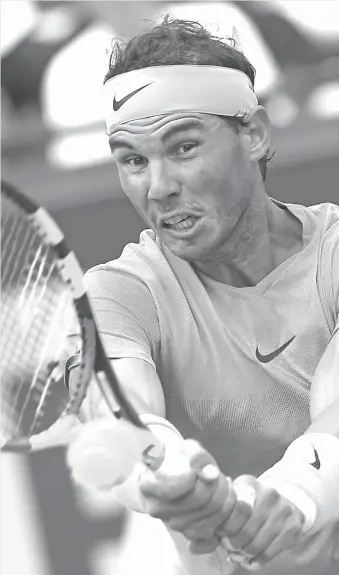  ?? AP Photo/Thibault Camus ?? RAIN-DELAYED. Spain's Rafael Nadal returns a shot against Argentina's Diego Schwartzma­n during their quarterfin­al match of the French Open tennis tournament at the Roland Garros stadium in Paris, France, Wednesday, June 6, 2018.