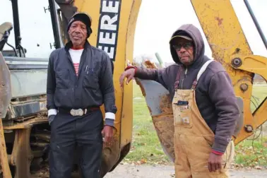 ?? CARA ANTHONY/KHN/TNS ?? Digging graves for a living wasn’t on the list of career aspiration­s for Johnnie Haire, left, or his colleague William Belt Sr. But that’s exactly what they’ve done for the past 43 years at Sunset Gardens of Memory cemetery in Millstadt, Illinois.