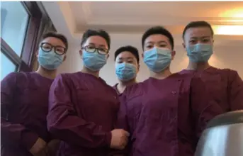  ??  ?? Wang Yani (left), a nurse from the Longde County People’s Hospital in Ningxia Hui Autonomous Region, poses with her teammates in Wuhan, Hubei, after they all got haircuts to reduce chances of coronaviru­s infection on February 9