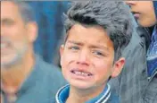  ?? WASEEM ANDRABI /HT ?? A Kashmiri boy cries at the funeral of 15yearold Amir Nazir who was killed in Thursday’s encounter between security forces and militants at Padgampora in Pulwama.