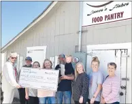  ?? Courtesy photograph ?? Board members from Audrey’s Resale Boutique recently donated $1,000 to Loaves ’n Fishes Food Pantry in Pea Ridge. Presenting and accepting the check were, from left: Kim Smith, Audrey’s Board Member; Jason Harvey; Rhiannon Harvey; Jennifer Harvey, director of Loaves ’n Fishes; Jimmy Harvey holding granddaugh­ter, Pierson; Abby Harvey; Hanna Harvey; and Peggy Siefert, Audrey’s board member.