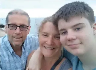  ??  ?? Living with illness: Keith and Julie Hardy with their teenage son, Ned