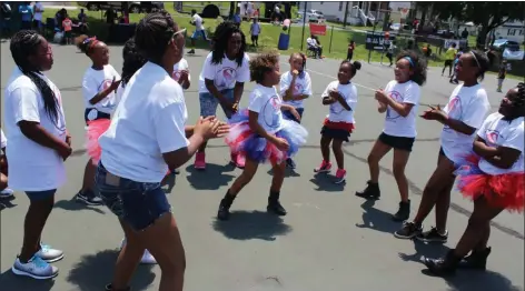  ?? MEDIANEWS GROUP FILE PHOTO ?? A group of girls dance in a circle during the Community Unity Day at Spruce Street Park in Pottstown.