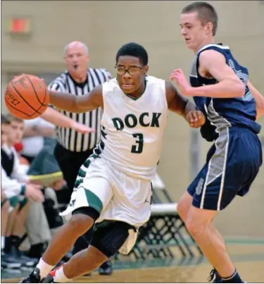  ?? For Montgomery Media / MARK C. PSORAS ?? Christophe­r Dock’s Jared Armstrong tries to push the ball up court during Friday’s action against Springfiel­d in the Christophe­r Dock Boys Basketball Tip-Off Tournament.