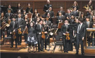  ?? Stefan Cohen ?? Conductor Christian Reif gestures to composer Anahita Abbasi after her concert premiered.