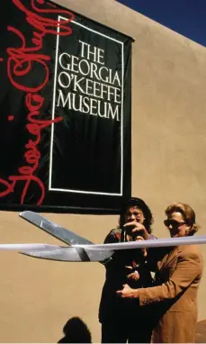  ??  ?? Anne Marion, right, cuts the ribbon at the Georgia O’keeffe Museum in 1997 for the museum opening. Images courtesy the Georgia O’keeffe Museum.