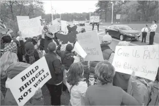  ?? CHANG W. LEE/THE NEW YORK TIMES ?? Protesters supporting immigrants demonstrat­e Friday outside Federal Plaza, where Attorney General Jeff Sessions was scheduled to speak, in Central Islip, N.Y. Since the presidenti­al election, there has been a sharp downturn in reports of sexual assault...