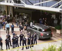  ?? Associated Press ?? Emergency personnel respond to a shooting at the Natalie Medical Building on June 1 in Tulsa, Okla.