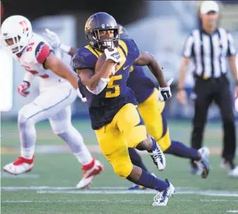  ?? D. Ross Cameron / Special to The Chronicle 2016 ?? Cal running back Tre Watson looks for open field against Utah last season, when Watson rushed for 709 yards and four touchdowns. He figures to improve on those stats this season.