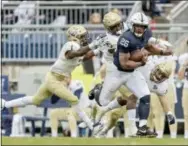  ?? ABBY DREW — THE ASSOCIATED PRESS ?? Penn State running back Saquon Barkley races downfield against Akron on Saturday.