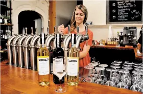  ??  ?? Nearly 40 British Columbia wines are on tap at the Vancouver Urban Winery.