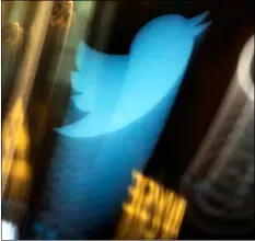  ?? AP FILE PHOTO/RICHARD DREW ?? In this 2013 file photo, the Twitter logo appears on an updated phone post on the floor of the New York Stock Exchange.