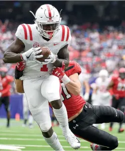  ?? AP Photo/Eric Christian Smith ?? ■ Mississipp­i wide receiver A.J. Brown runs into the end zone for a touchdown as Texas Tech defensive back Justus Parker tries to make the tackle Sept. 1 in Houston. Mississipp­i won 47-27.