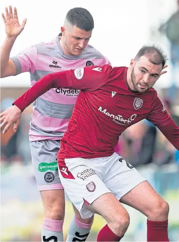  ?? ?? BATTLING: Arbroath’s Gordon Walker holding off Partick Thistle’s Aidan Fitzpatric­k.