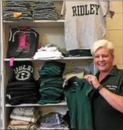  ?? BARBARA ORMSBY – DIGITAL FIRST MEDIA ?? Kelli Mullany, director of pupil services for Ridley School District, displays school uniforms in the new school district store intended to help those in the district in need meet the schools’ dress codes.