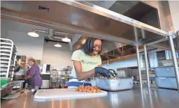  ?? CHERYL EVANS/THE REPUBLIC ?? Maya Bartlett, owner of Maya's Cajun Kitchen, prepares jambalaya. Bartlett will participat­e in the Vegan Drive-Thru at The Nile.