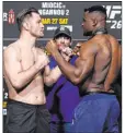  ?? Jeff Bottari Zuffa LLC ?? Stipe Miocic, left, and Las Vegas resident Francis Ngannou face off during the UFC 260 weigh-in at UFC Apex on Friday ahead of Saturday’s fight.