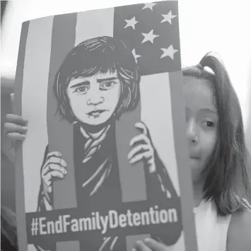  ?? AGENCE FRANCE PRESSE ?? A girl takes part in a protest in Chicago against the US immigratio­n policies separating migrant families.