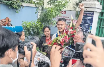  ?? ?? DIGITAL DYSTOPIA: Kak Sovann Chhay, the 16-year-old son of an opposition politician, leaves prison in Phnom Penh on Nov 10, 2021. Kak Sovann Chhay was jailed for comments he made in a Telegram chat group.