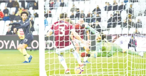  ?? — AFP photo ?? Manchester City’s German midfielder Leroy Sane (left) scores their fourth goal during the English Premier League football match between West Ham United and Manchester City at The London Stadium, in east London.