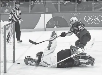  ?? Associated Press ?? Game-winner: United States' Jocelyne Lamoureux (17) scores the game-winning goal in the shootout against Canada during the women's gold medal hockey game at the 2018 Winter Olympics in Gangneung, South Korea, Thursday.