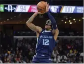  ?? BRANDON DILL — THE ASSOCIATED PRESS ?? Memphis guard Ja Morant scored 17 points in his return from a suspension Wednesday in the Grizzlies’ victory.