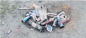  ??  ?? Rene Lemckert found a pile of used fireworks tossed on the side of the road while riding along Harrison East Forest Service Road.