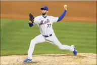  ??  ?? Noah K. Murray / Associated Press Mets starting pitcher David Peterson throws to a Braves batter during the third inning Saturday.