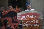  ?? SILVIA IZQUIERDO — THE ASSOCIATED PRESS FILE ?? Activists protest the Australian government’s response to wildfires outside the Australian consulate in Rio de Janeiro, Brazil.