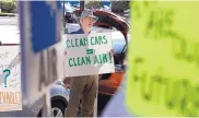  ?? GARY KAZANJIAN/ASSOCIATED PRESS ?? Paul Gipe protests in Fresno, Calif., on Monday before the first of three public hearings on the Trump Administra­tion’s proposal to roll back car-mileage standards.