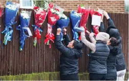  ??  ?? Row: Relatives left tributes to Vincent near the home of Mr Osborn-Brooks, above