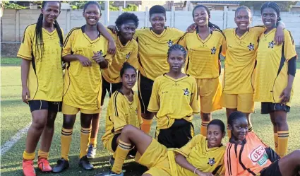  ?? Picture: TAMMY FRAY ?? NEW DAWN: The East London High School girls soccer team poses for a team photo after their match against Mzomhle High School at North End Football Stadium last Thursday