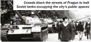  ?? ?? Crowds block the streets of Prague to halt Soviet tanks occupying the city’s public spaces