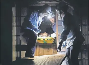  ?? — AFP photo ?? This picture shows a survivor being rescued from his house in the Mabicho district in Kurashiki some three days after flooding caused by rains devastated parts of Japan.