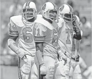  ?? MANNY RUBIO/ USA TODAY SPORTS ?? Defensive linemen Leroy Selmon, Dewey Selmon ( 61) and Council Rudolph ( 78) played for the 0- 14 Buccaneers in 1976.