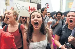  ?? TIMOTHY A. CLARY AFP/GETTY IMAGES ?? Women protest against Brett Kavanaugh before his confirmati­on as a U.S. Supreme Court justice last week. Rape network RAINN says an American suffers a sexual assault every 98 seconds.